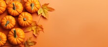 Top View Of Orange Pumpkins On A Colored Table Background Emblematic Of Autumn Halloween And Thanksgiving Flat Lay Photo With Copy Space