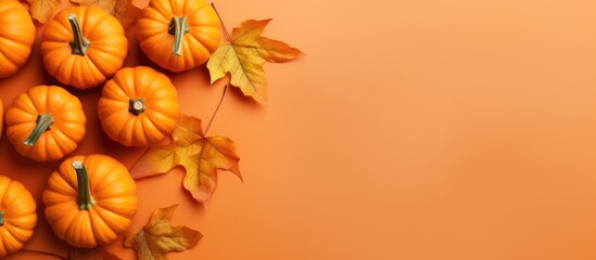 Aufkleber - Top view of orange pumpkins on a colored table background Emblematic of autumn Halloween and Thanksgiving Flat lay photo with copy space
