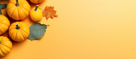 Aufkleber - Little orange pumpkins on a colored table background representing autumn and fall festivities