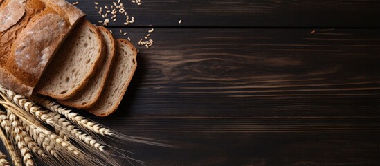 Poster - Close up top view of whole wheat bread on dark wooden board