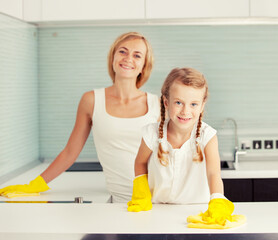 Mother with child washing kitchen