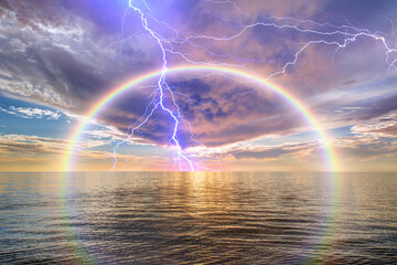 Wall Mural - Calm sea before storm with amazing rainbow and lightning at sunset   