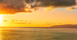 Fototapeta Zachód słońca - scenic landscape of colorful sunset or sunrise above water, evening or morning seascape