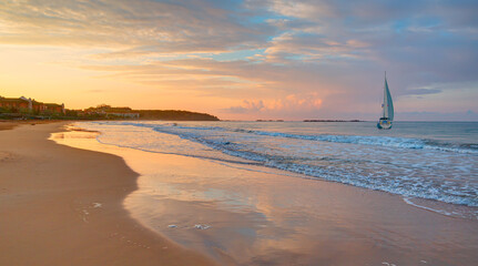 Canvas Print - Colorful sea beach sunrise. Beautiful incekum beach scenery with calm waves and soft sandy beach. Empty tropical landscape - incekum, Alanya
