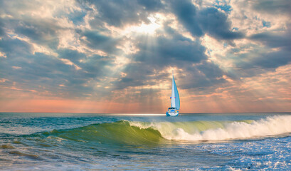 Wall Mural - Yacht sailing in open sea at stormy day - Anchored sailing yacht on calm sea with tropical storm 