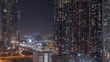 © HyperlapsePro - Business bay district skyline with modern architecture night timelapse from above.