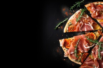 Wall Mural - Slices of pizza with prosciutto and spices on black background