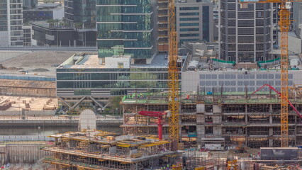 Wall Mural - Large construction site with many working cranes timelapse.