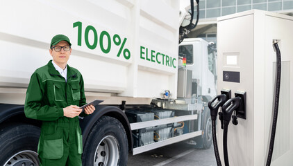 Poster - Manager with a digital tablet next to electric garbage truck and ekectric vehicles charging station
