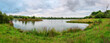 Panorama of Branton Lakes Nature Reserve, which was constructed from a former mineral quarry, located at Branton in the Breamish Valley, Northumberland