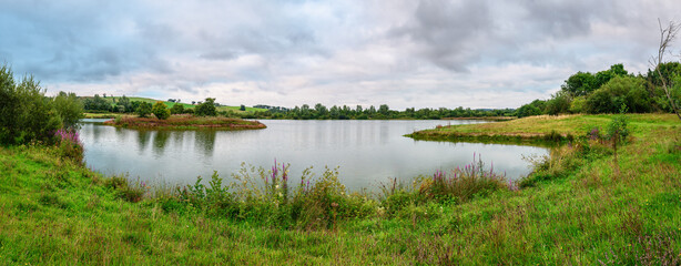 Sticker - Panorama of Branton Lakes Nature Reserve, which was constructed from a former mineral quarry, located at Branton in the Breamish Valley, Northumberland