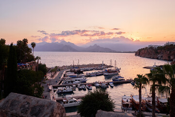 Wall Mural - Landscape with ancient sea marina between cliffs. Sunset in Antalya, Turkey.