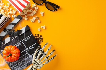 Embrace Halloween cinema vibe with thematic decor on orange backdrop. Top view spooky elements like skeletal hand, pumpkin, bat. 3D glasses, film clapper, popcorn boxes. Add text or ad in empty space