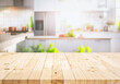 Selective focus.Wood table top on blur kitchen counter in morning background.For montage product display