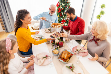 Wall Mural - Family having Christmas dinner together at home