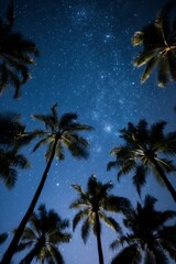 Wall Mural - Palm trees on the tropical beach against night blue and purple sky full of stars and nebulas. Beautiful background with green nature. Up view from below.