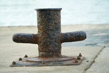 Old Rusty Mooring Bollard On The Seashore,The Best Way For Boat Or Ship Mooring In Harbor.Koh Chang Pier