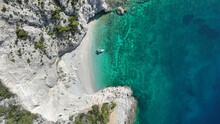 Aerial Drone Photo Of Secluded Paradise Exotic Island White Beach With Crystal Clear Turquoise Sea Surrounded By Steep White Cliffs