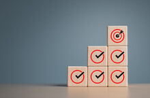 Checklist And Target Goal Key Achievement For Business Success. Corporate Regulatory And Compliance. Project Process Tracking. Mission Task Management Timeline. Wooden Cubes With A Target Check Icon.