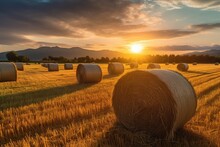 Hay Bales In A Field With Sunset , Concept Of Golden Hour 