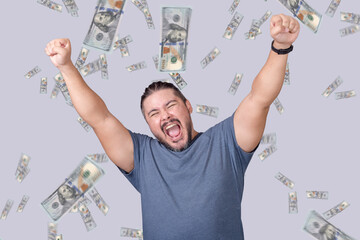 A man celebrating winning a large amount of money. A shower of hundred dollar bills. A lottery or sweepstakes jackpot winner.