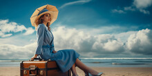 Beautiful Woman Sitting On A Suitcase With An Umbrella On The Beach