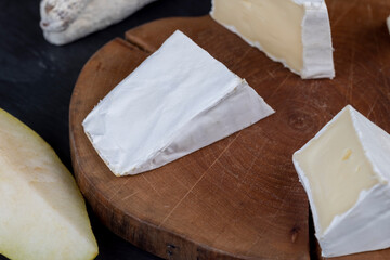 delicious sliced cheese with edible white mold