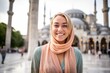 Close-up portrait photography of a joyful girl in her 20s wearing an elegant halter top at the blue mosque in istanbul turkey. With generative AI technology