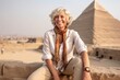 © Markus Schröder - Photography in the style of pensive portraiture of a cheerful mature woman wearing a cute crop top in front of the pyramids of giza in cairo egypt. With generative AI technology