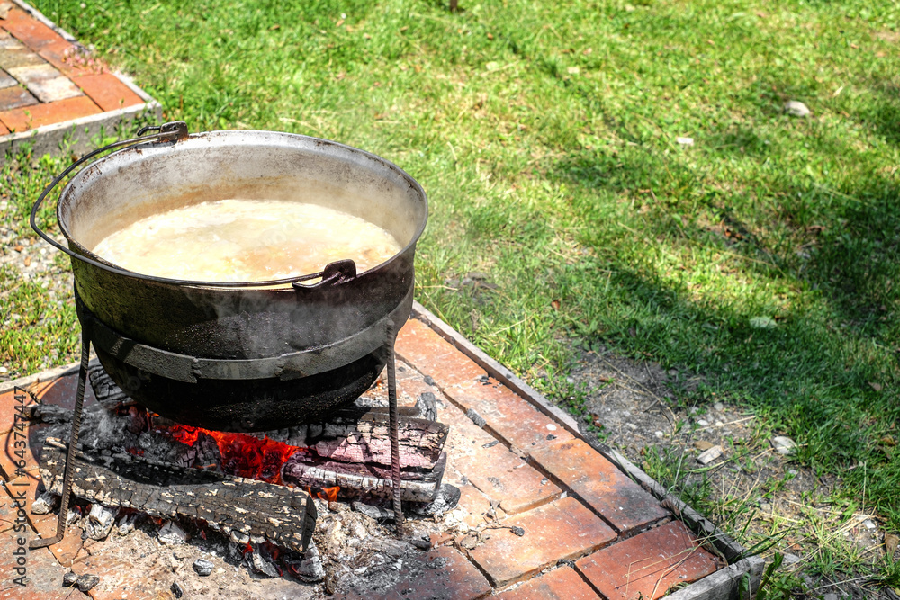 Open Cauldron Romanian traditional food prepared at the cauldron on the open fire ...