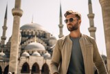 Fototapeta  - Lifestyle portrait photography of a content boy in his 30s wearing a long-sleeved thermal undershirt at the blue mosque in istanbul turkey. With generative AI technology