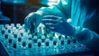 © FutureFocus - Hand wearing sanitary gloves meticulously checking medical vials. Medical diagnosis concept,