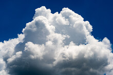 Clouds Billowing In The Blue Sky In Summer