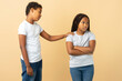 Attractive African American girl and boy, little brother apologizing to his little sister supporting