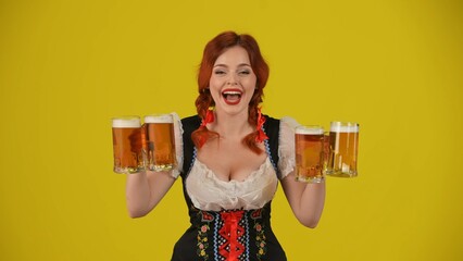 Medium yellow background isolated shot of a young German woman, waitress, wearing a traditional costume, holding four glasses of lager, beer, expressing wow and excitement.