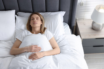 Wall Mural - Woman snoring while sleeping in bed at home