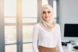 © the_lightwriter - muslim businesswoman in an office