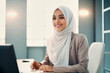 © the_lightwriter - muslim businesswoman in an office