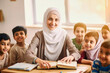 © the_lightwriter - muslim female teacher in front of her class