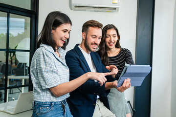 Wall Mural - Happy diverse friends watching funny video, laughing at joke, using laptop and having fun together, brainstorm together at meeting	