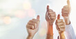 © Valerie M/peopleimages.com - Mockup, success or hands of business people with thumbs up for approval on sky background. Teamwork, community or closeup of employees with solidarity or group support for growth, like or okay sign
