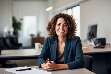 smartly dress female business woman working in office