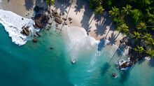 Behold The Coastal Paradise As The Drone Soars Above The Shoreline. The Photography Reveals The Azure Waters, The Pristine Beaches, And The Lush Palm Trees, Offering A Vivid Depiction.