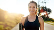 © Valerie M/peopleimages.com - Fitness, portrait and happy woman with earphones outdoor on road at sunrise, training workout or exercise. Listening to music, smile and face of athlete in nature for wellness, healthy body or sport