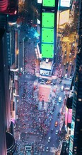 Vertical Screen: Helicopter Night Tour Of New York City. Glowing Times Square With Green Screen Mock Up Advertising Templates And Tourists Enjoying Manhattan Nightlife And Admiring The Landmark