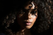 © Sergio - Beauty portrait afro american sensual woman model with curly hair looking at camera, closeup shadow on female face, femininity