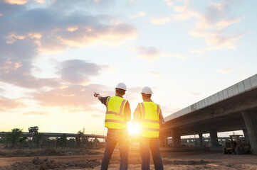 The chief civil engineer is introducing inspection of a road or expressway construction project under the road to an intern. At the expressway construction site