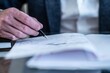 © Daniel Jędzura - Architect or lawyer signs an important document in his office
