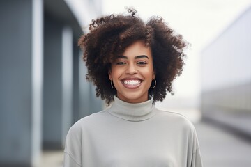 Wall Mural - Portrait of a happy smiling modern girl of African American ethnicity with curly hair