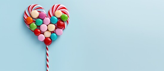 Aufkleber - Festive multicolored candy cane without shadow on a isolated pastel background Copy space Decorative striped texture Top view